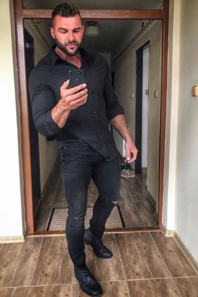 black shirt paired with ripped skinny jeans and ankle boots