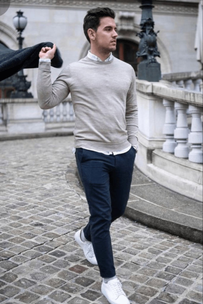 Preppy Perfection: Think slim-fit chinos, a crisp button-down shirt, and a knit sweater draped over your shoulders. Add your white sneakers into the mix for a fresh and modern twist on classic prep style. white sneakers men outfit